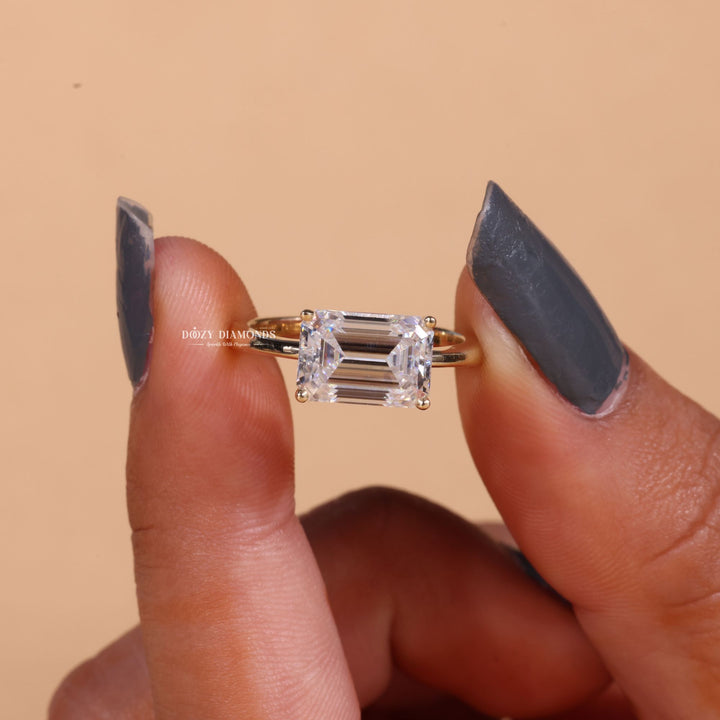 Emerald east west lab grown diamond ring side profile in gold setting