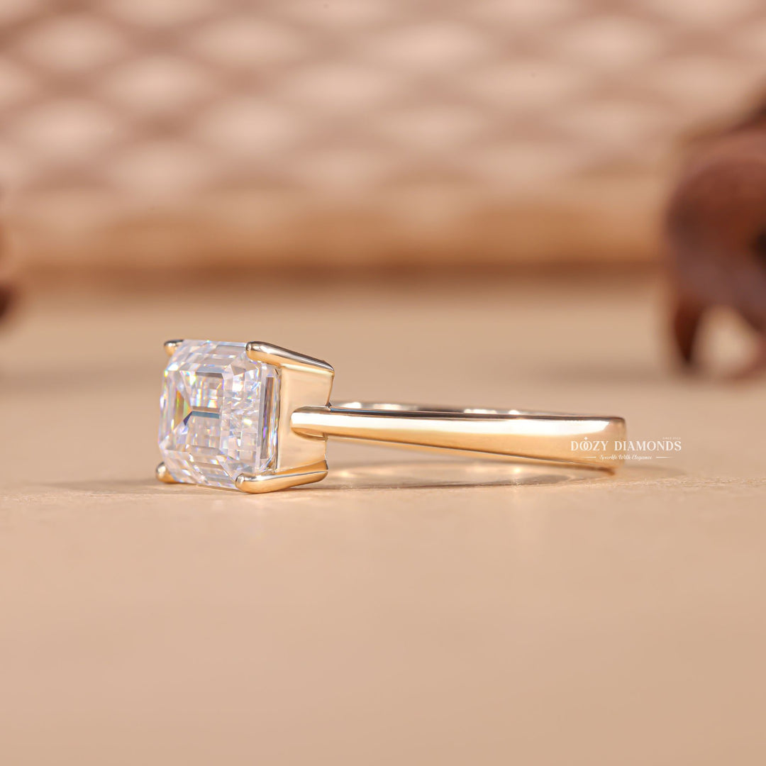 Side angle of emerald east west diamond engagement ring
