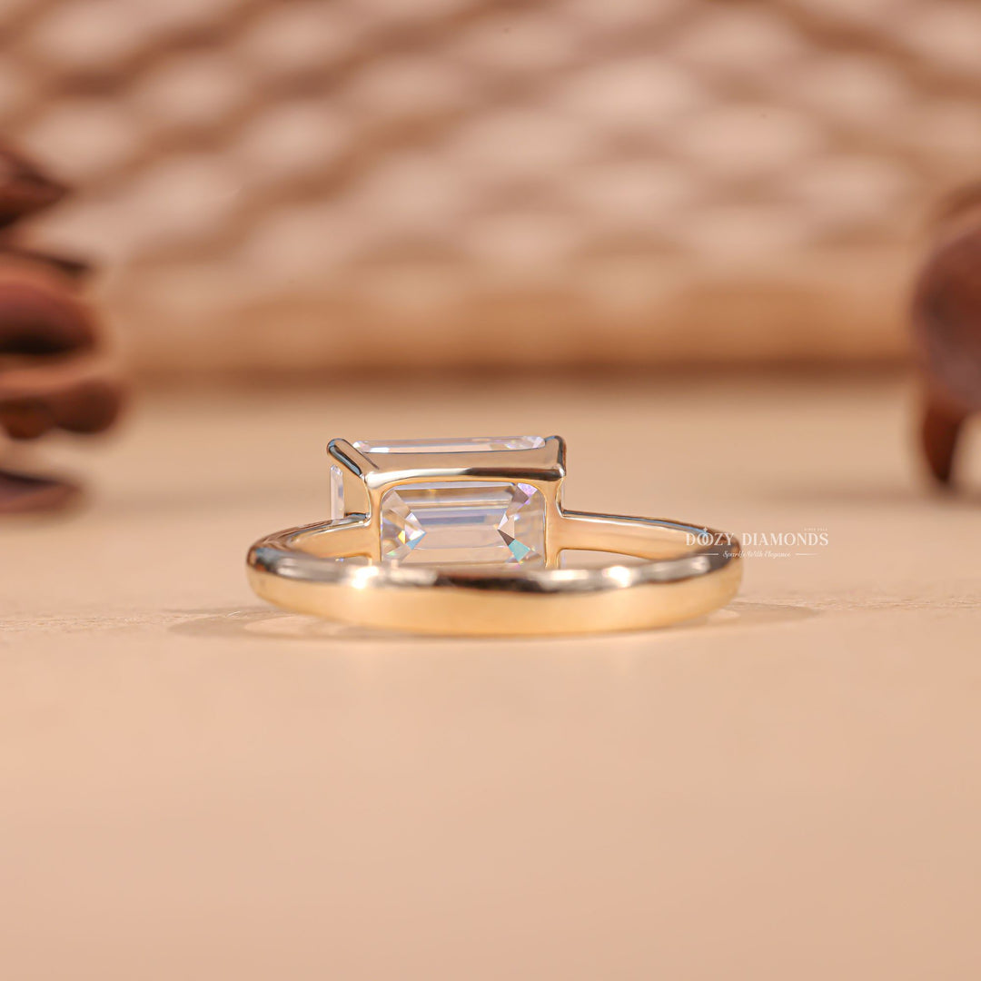 Emerald cut engagement ring side view showing band detail