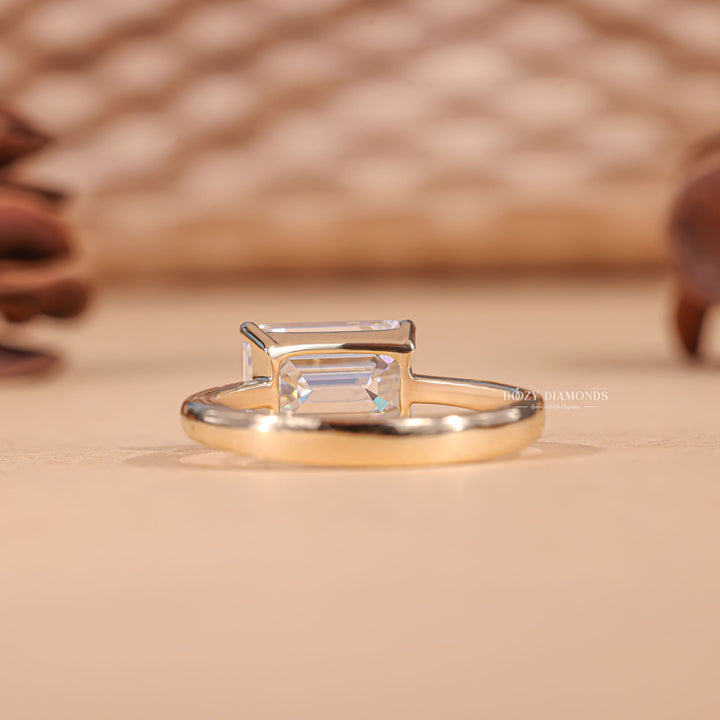 Emerald cut engagement ring side view showing band detail
