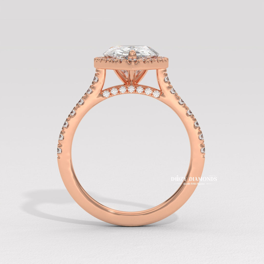 Detailed close-up of pear halo diamond engagement ring