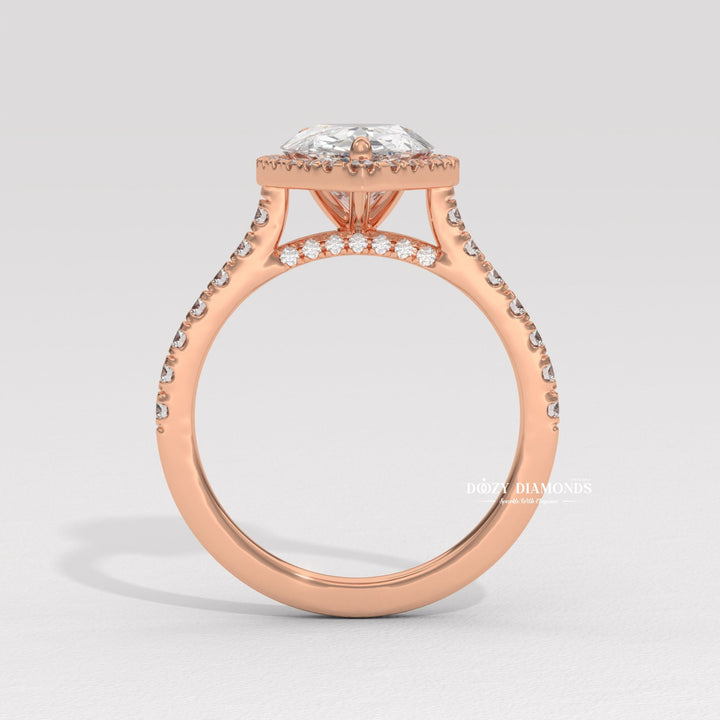Detailed close-up of pear halo diamond engagement ring