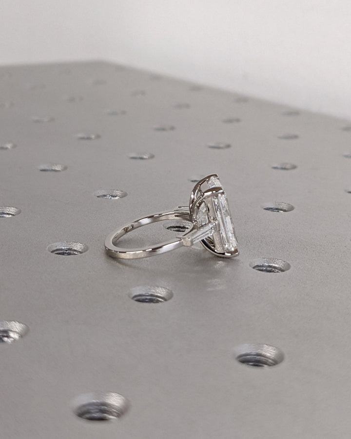 Radiant three stone engagement ring with brilliant diamond sparkle