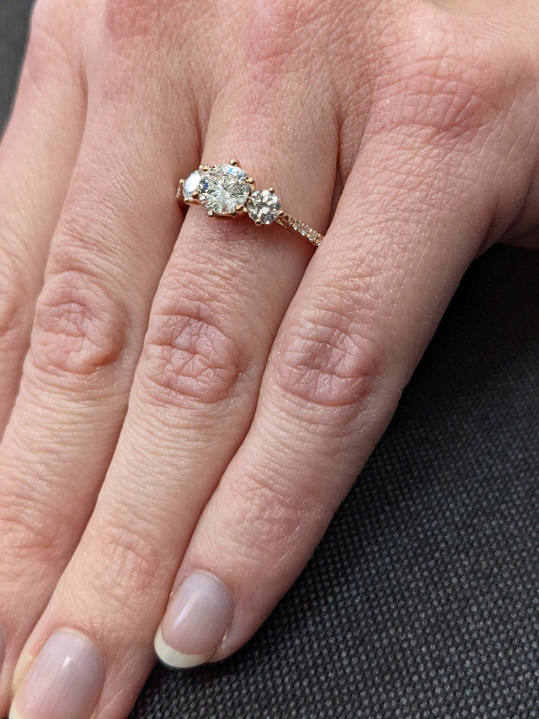 Round cut engagement ring side view showing band detail
