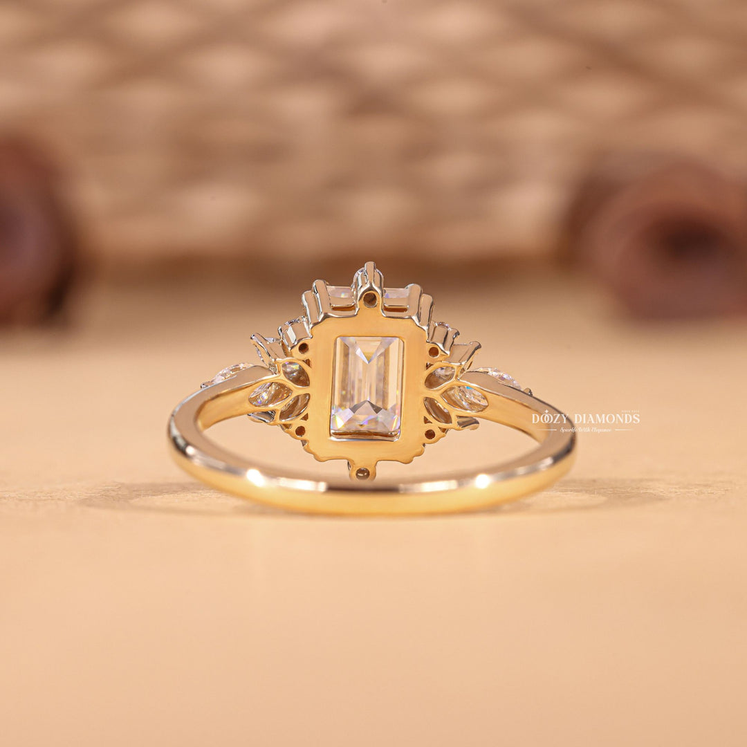 Emerald cluster engagement ring close-up showing E/VS1 diamond clarity