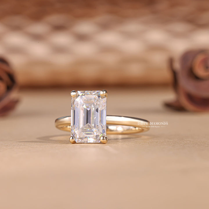 Emerald cut engagement ring side view showing band detail