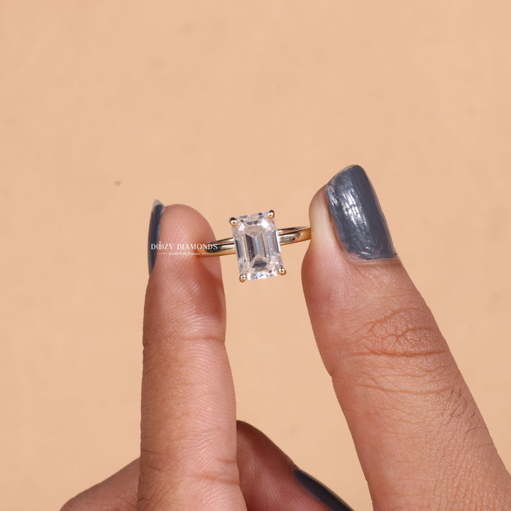 Close-up of emerald cut center diamond in solitaire engagement ring