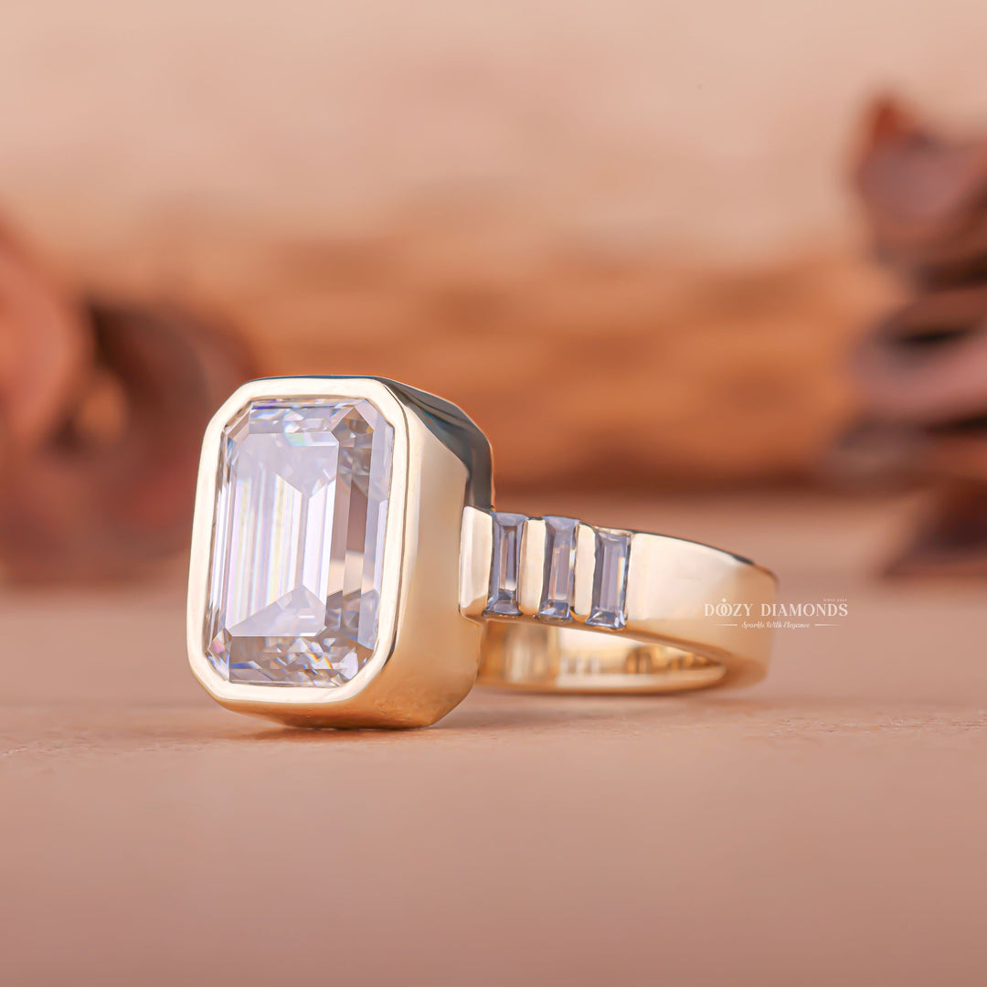 Emerald bezel engagement ring shown on hand for true-to-life sizing
