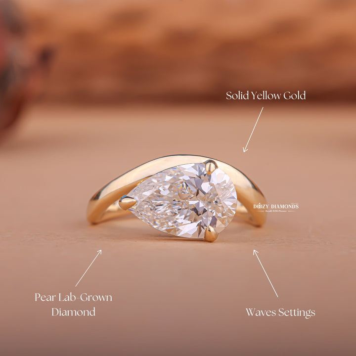 Angled view of pear cut diamond in east west setting
