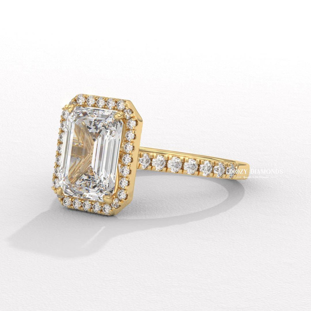 Certified emerald cut diamond featured in pave engagement ring