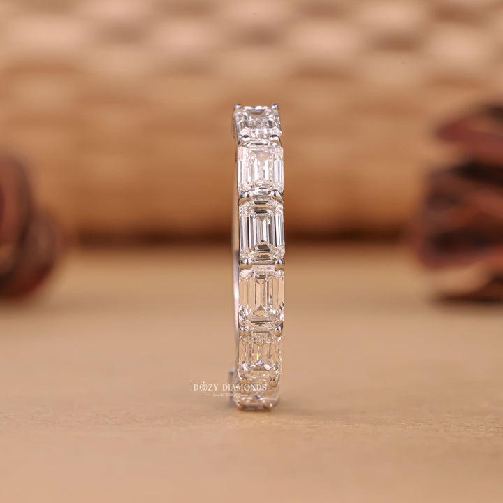 Eternity emerald diamond wedding band front view