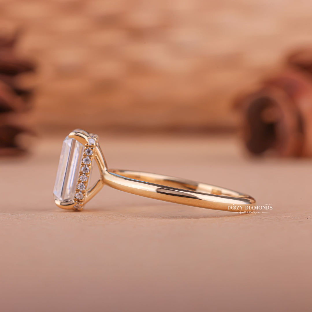 Emerald hidden halo engagement ring shown on hand for true-to-life sizing