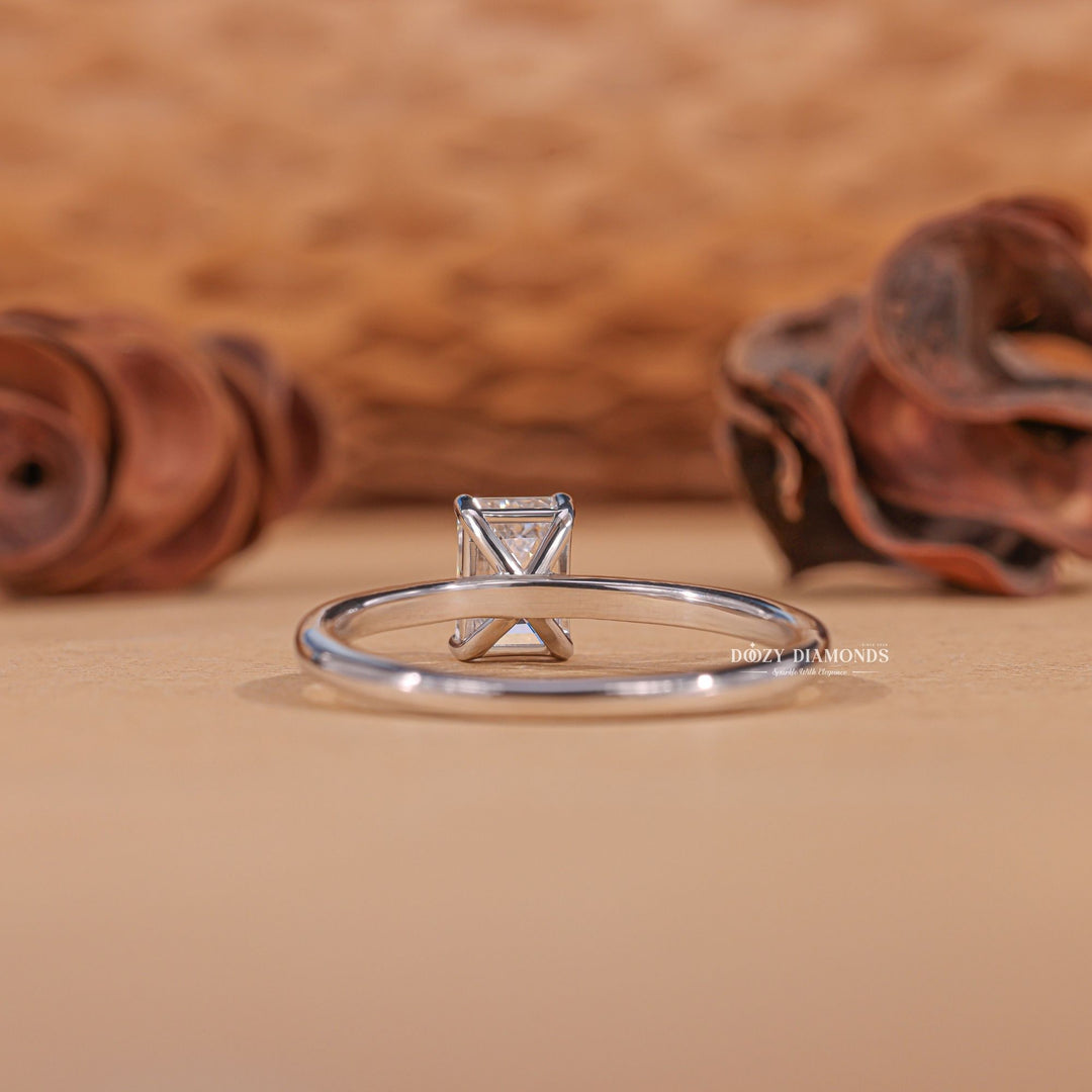 Emerald solitaire engagement ring offered in gold and platinum