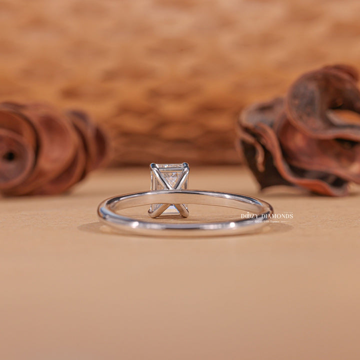 Emerald solitaire engagement ring offered in gold and platinum