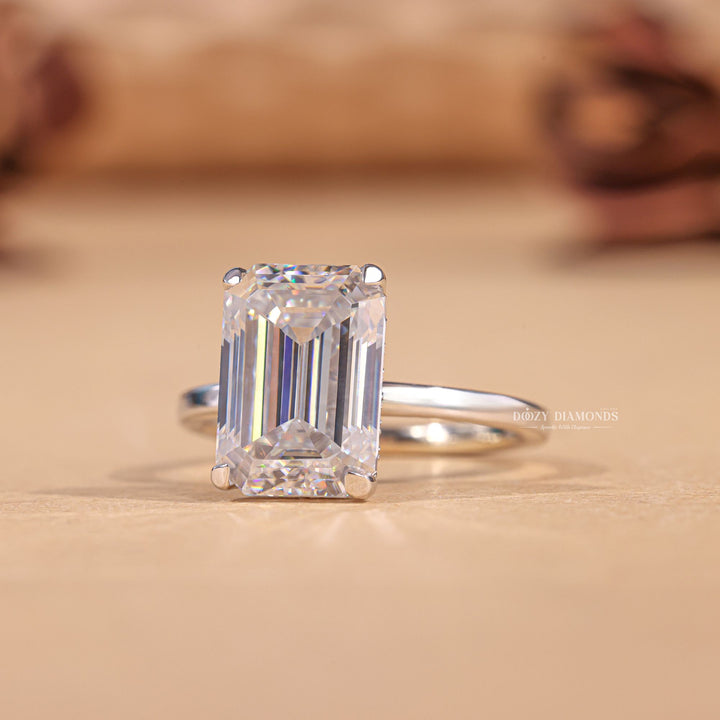 Emerald hidden halo engagement ring viewed from the side