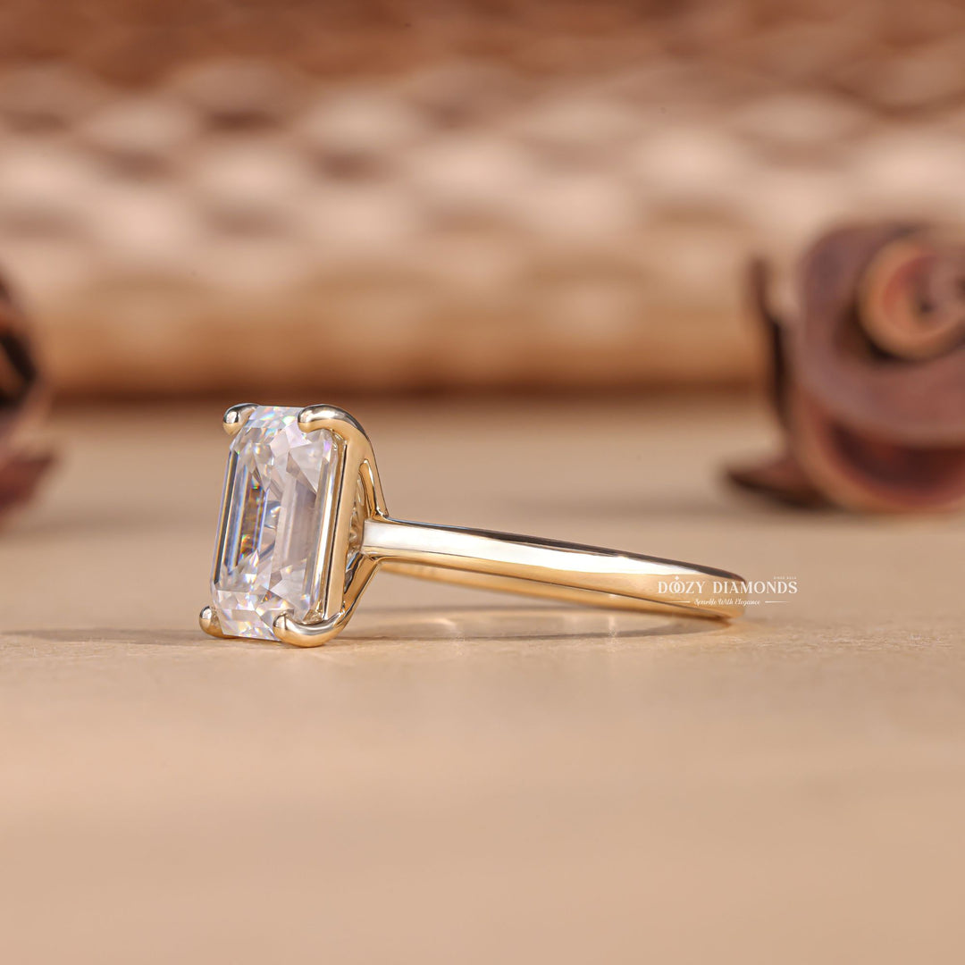 Emerald solitaire lab grown diamond ring side profile in gold setting