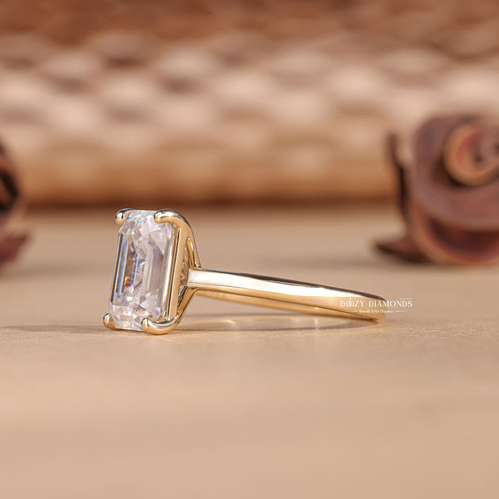 Emerald solitaire lab grown diamond ring side profile in gold setting