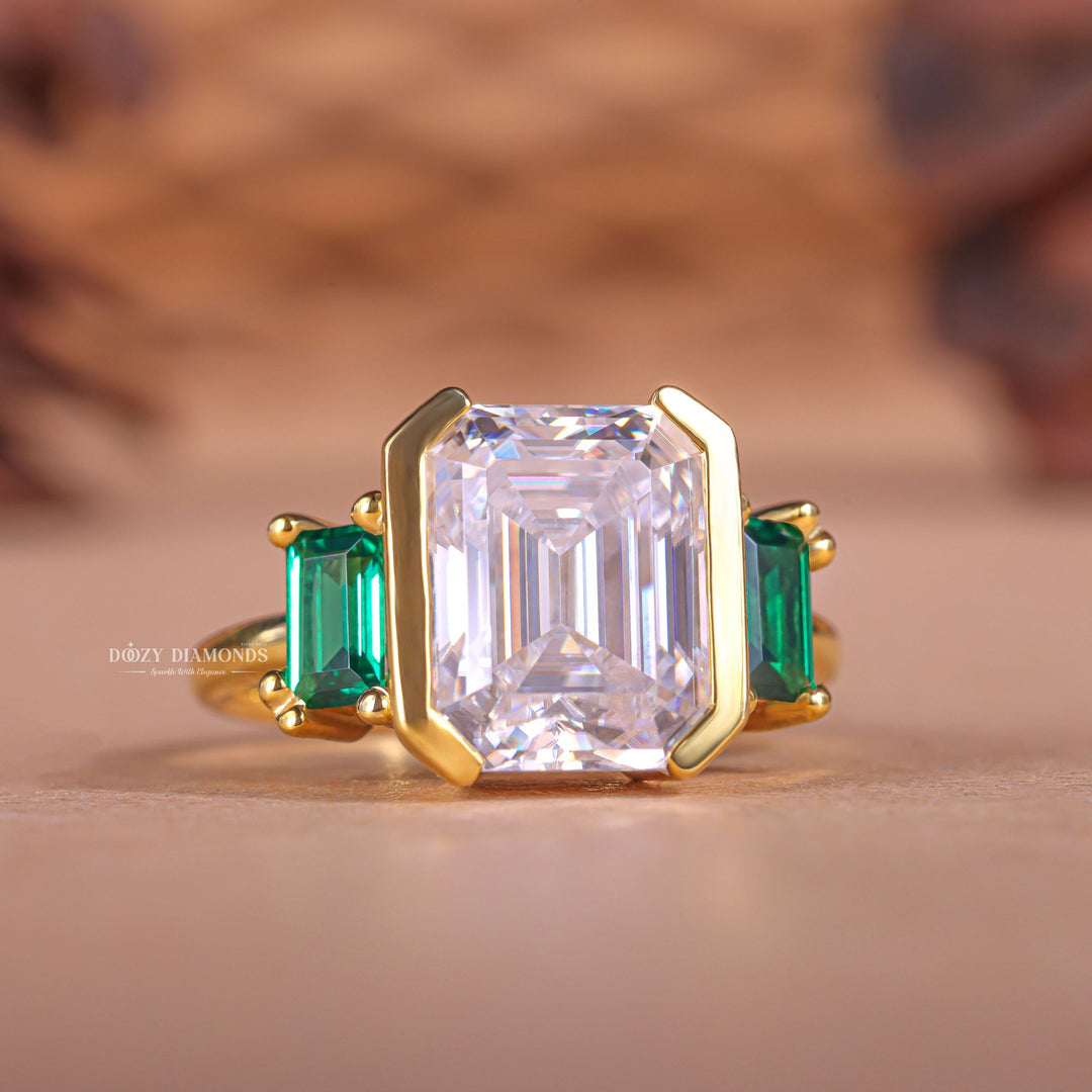 Unboxing view of emerald cut three stone diamond engagement ring