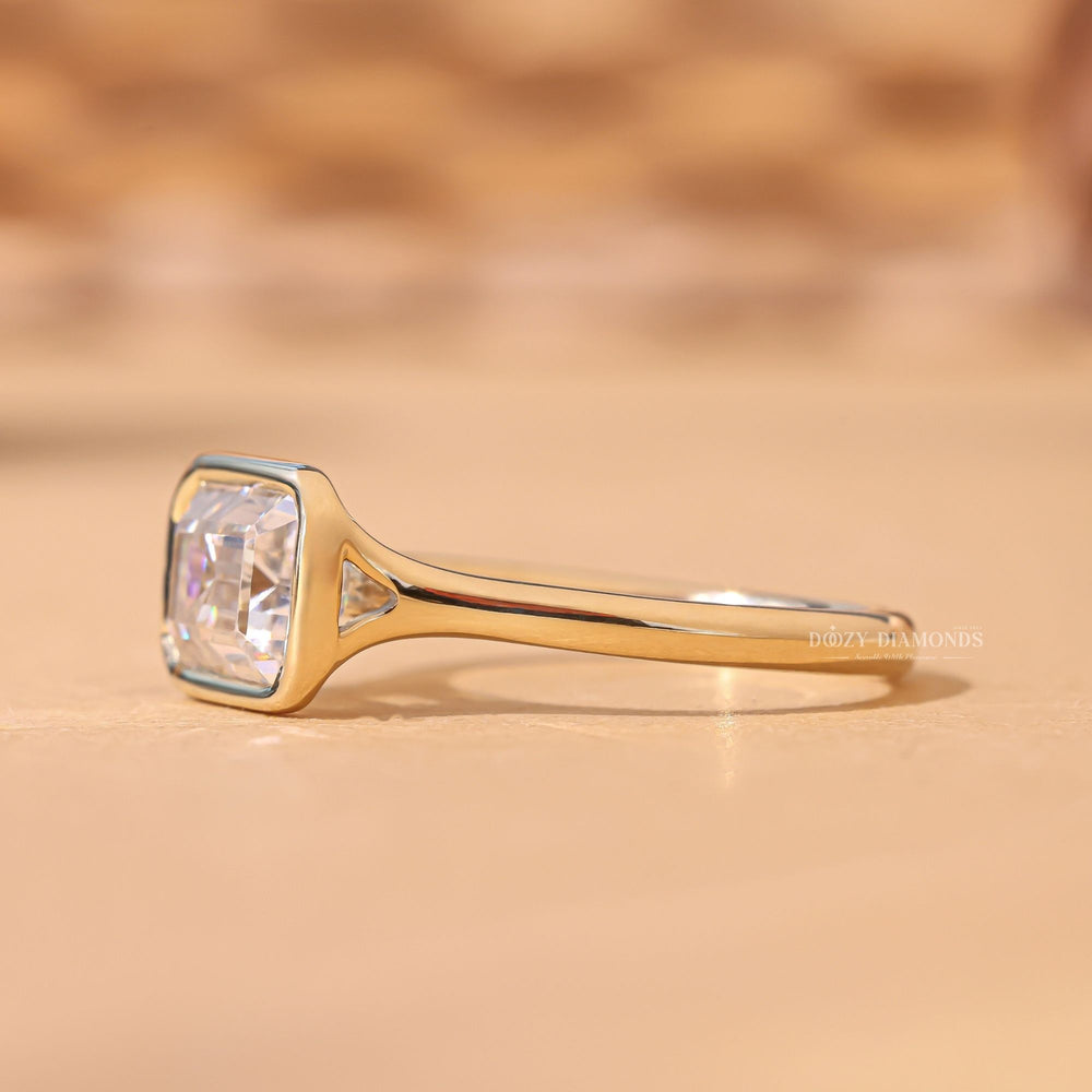 Emerald bezel engagement ring viewed from the side