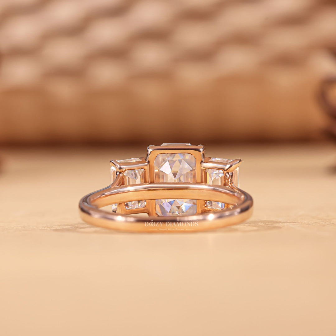 Emerald cut engagement ring shown with authenticity certificate