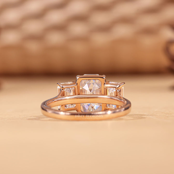Emerald cut engagement ring shown with authenticity certificate