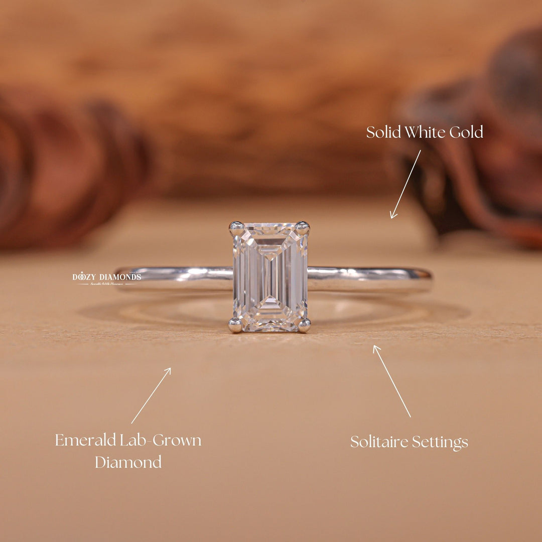 Emerald solitaire diamond ring presented in signature gift packaging