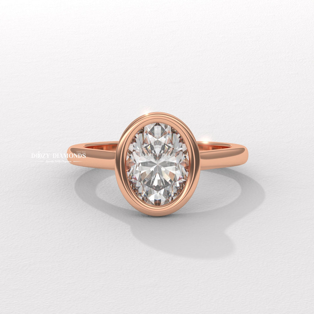 Profile view of oval cut bezel engagement ring band