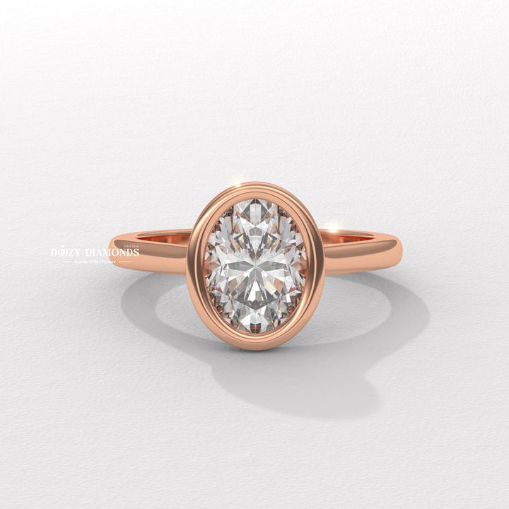 Profile view of oval cut bezel engagement ring band