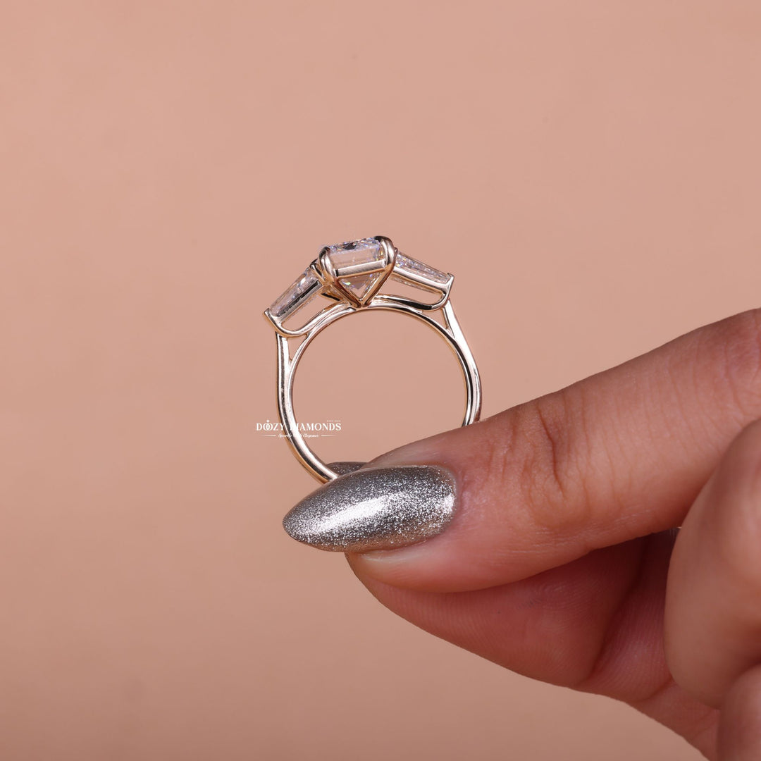Emerald three stone lab grown diamond ring fitted on finger