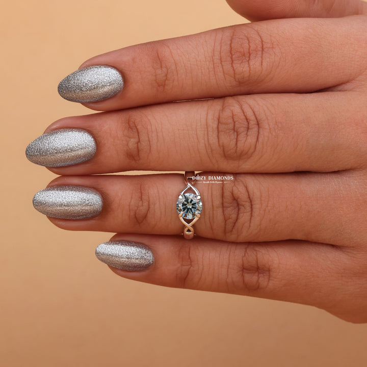 Round solitaire lab grown diamond ring fitted on finger