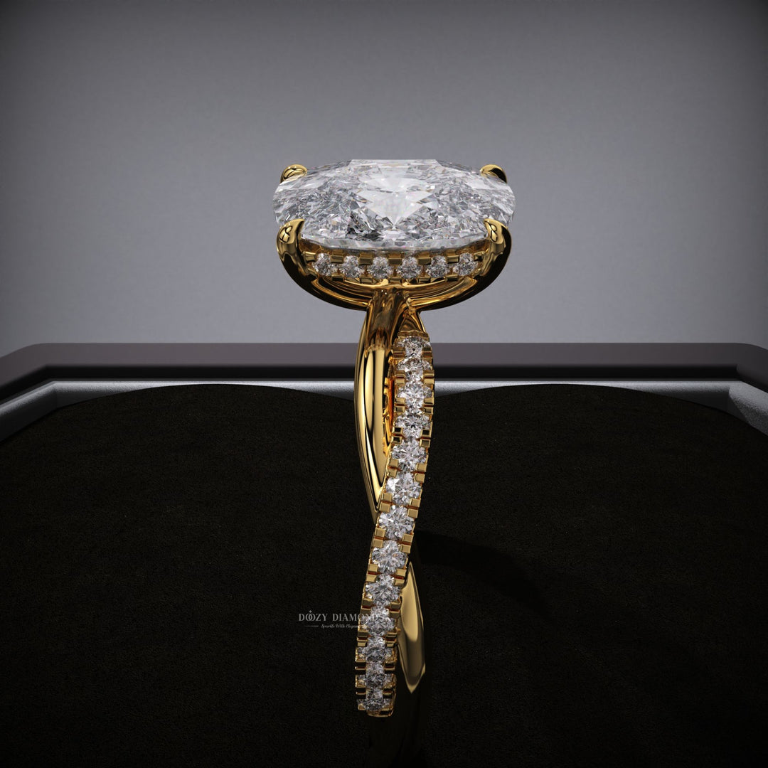 Cushion hidden halo engagement ring offered in gold and platinum