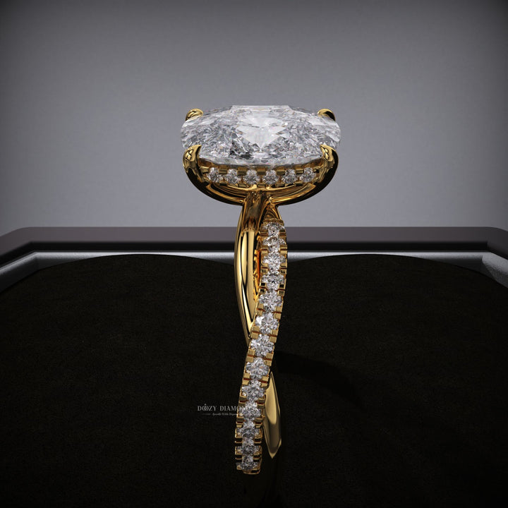 Cushion hidden halo engagement ring offered in gold and platinum