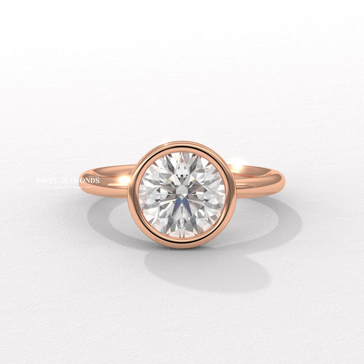 Round bezel ring set with an IGI graded diamond