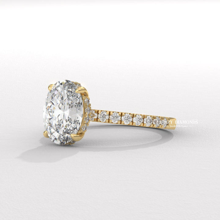 Oval hidden halo engagement ring close-up highlighting diamond sparkle