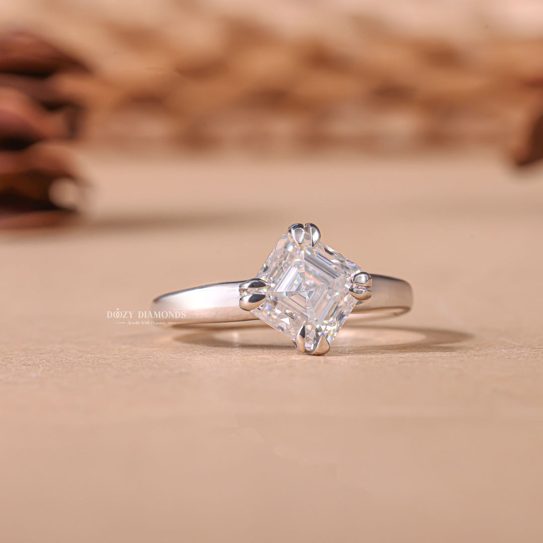 Lifestyle shot of asscher solitaire diamond ring on hand