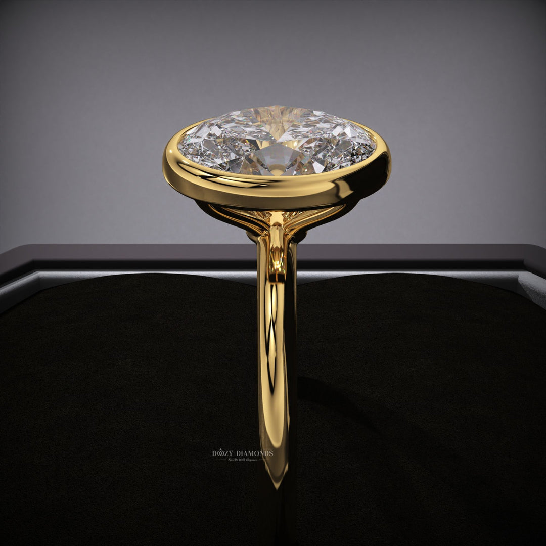 Oval bezel engagement ring with certified lab grown diamond