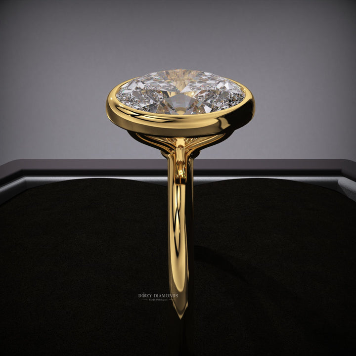 Oval bezel engagement ring with certified lab grown diamond