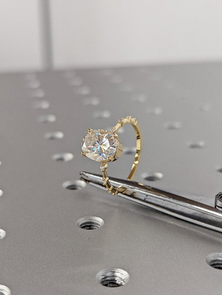 Oval pave engagement ring offered in gold and platinum