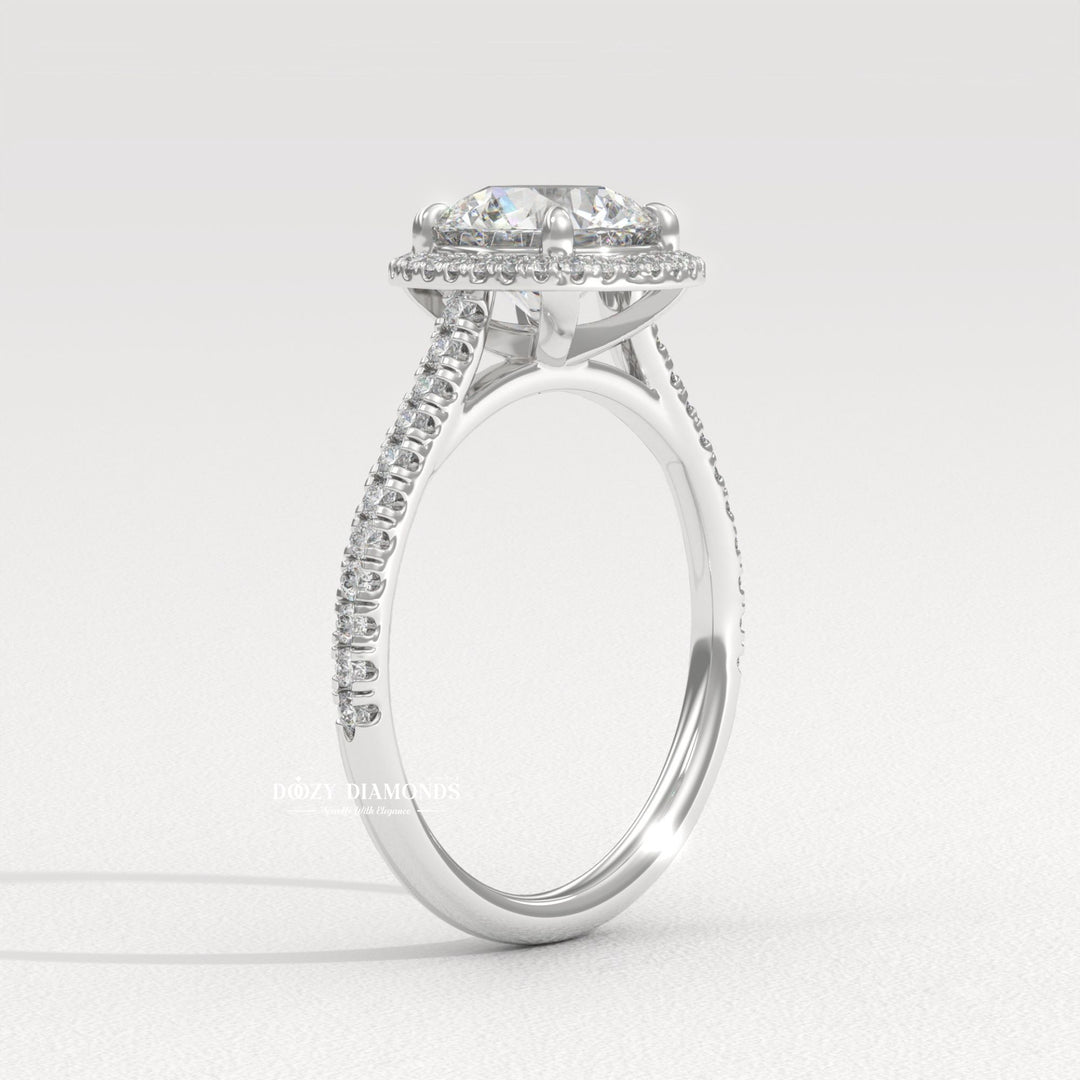 Round cut diamond ring worn on hand