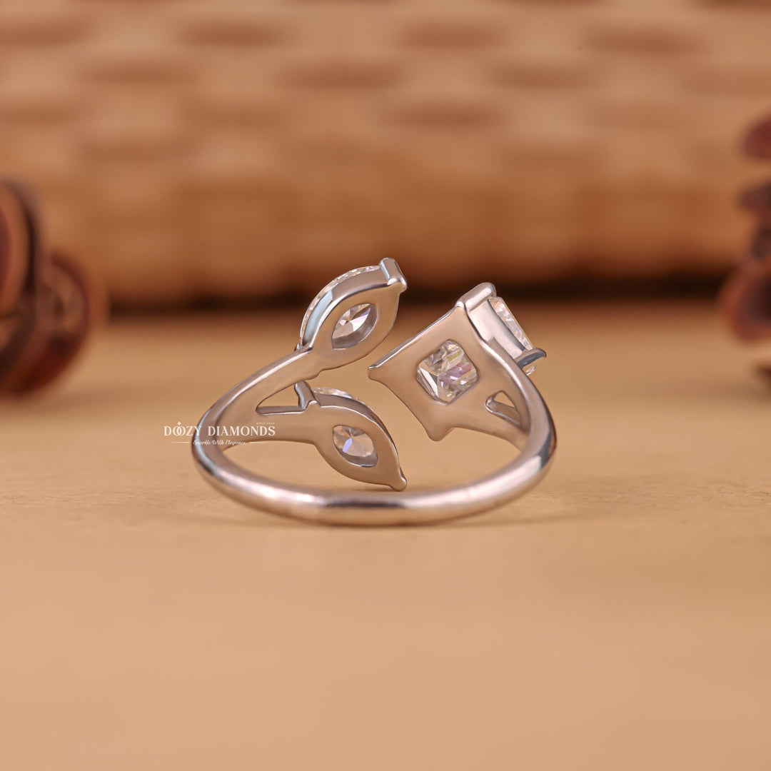 Macro shot of marquise cut diamond facets in three stone ring setting