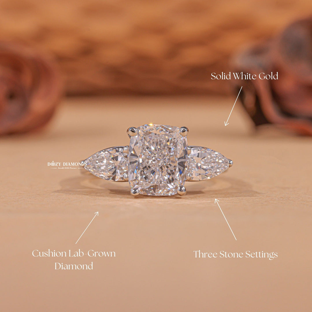 Cushion three stone diamond engagement ring available in multiple metals