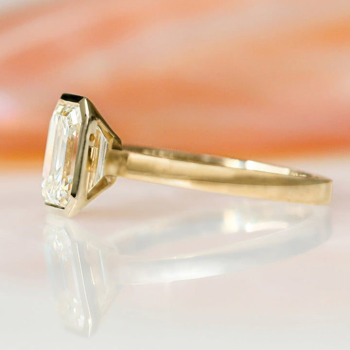 Emerald bezel diamond engagement ring available in multiple metals