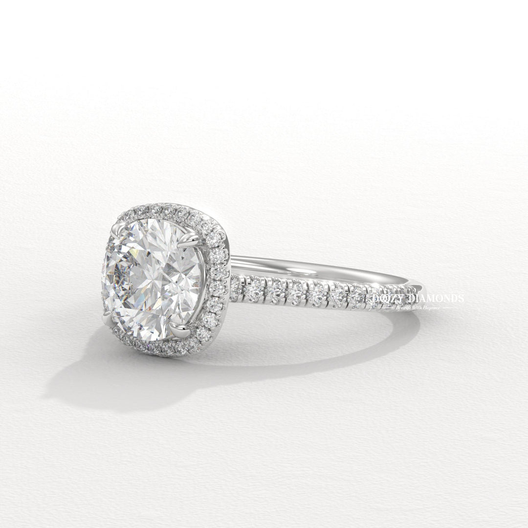 Round halo engagement ring shown on hand for true-to-life sizing