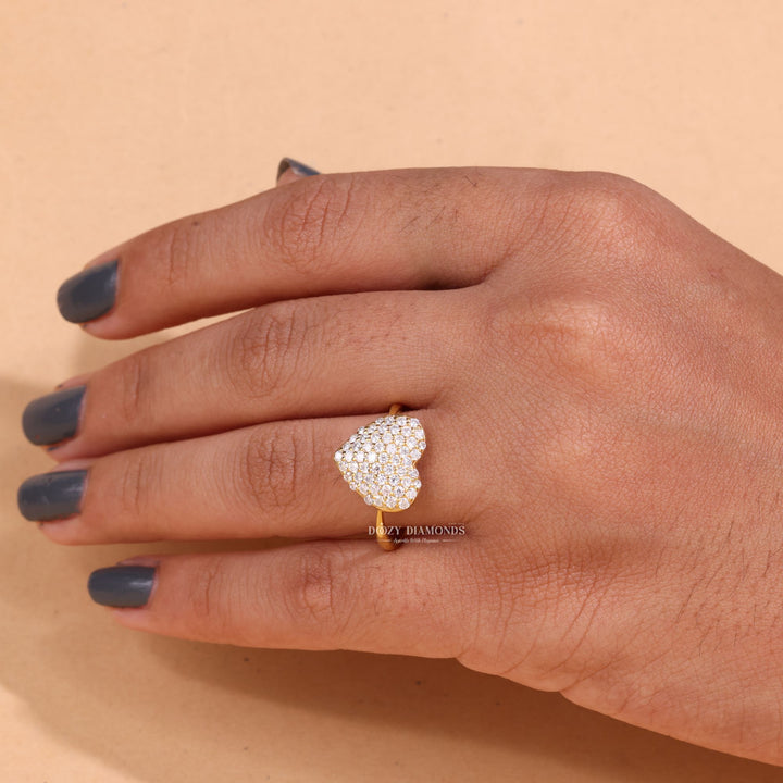 Detailed close-up of round solitaire diamond engagement ring