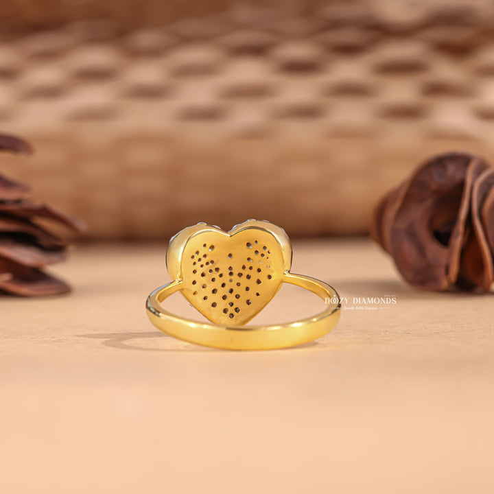 Round solitaire engagement ring viewed from the side