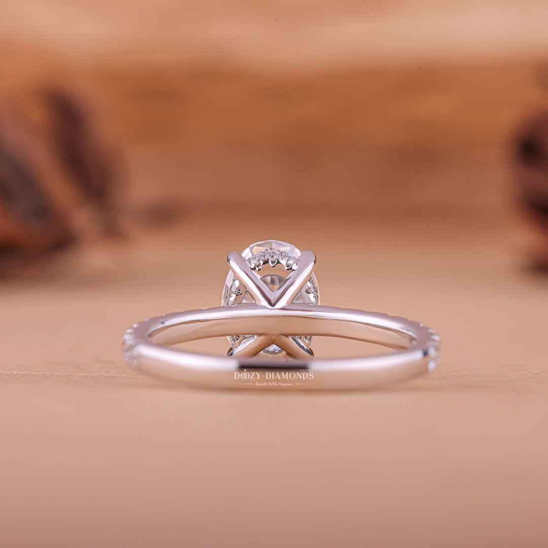 Certified oval cut diamond featured in hidden halo engagement ring