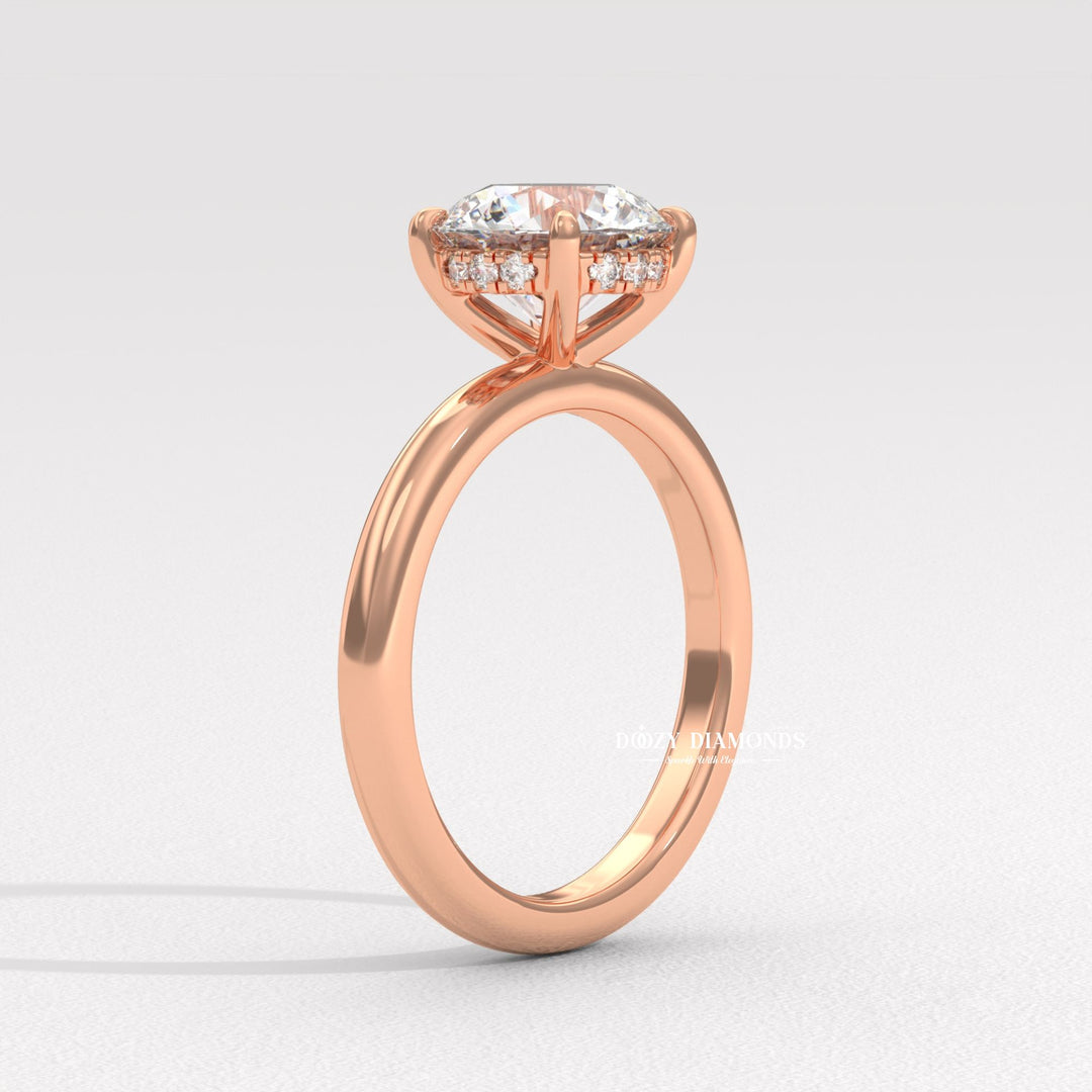 Round hidden halo engagement ring photographed in natural light