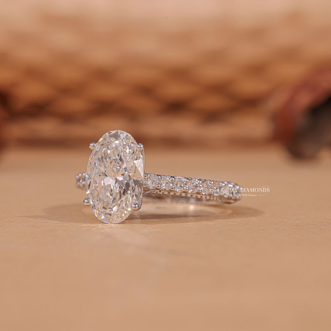 Oval hidden halo diamond ring presented in signature gift packaging