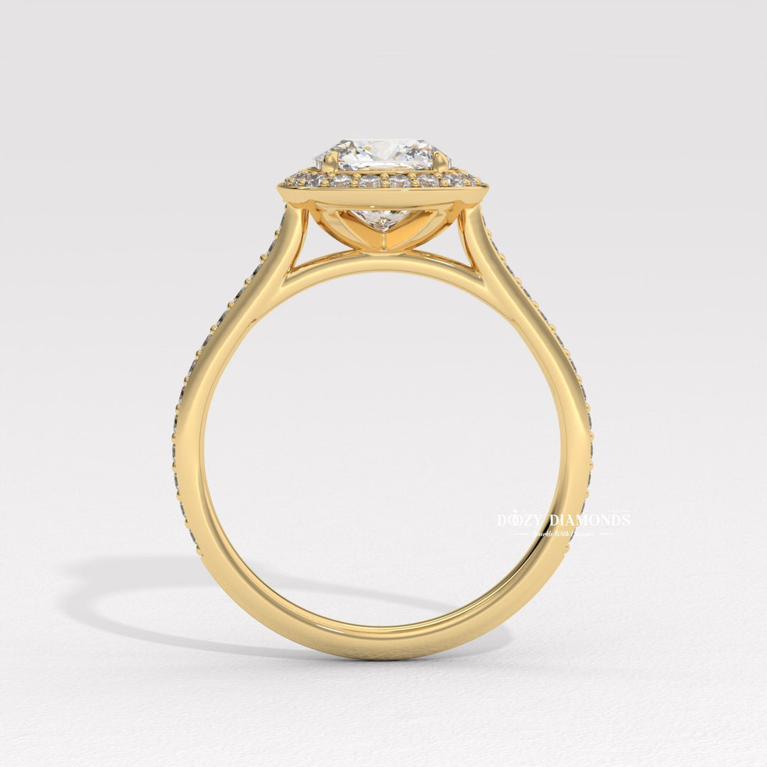 Macro shot of cushion cut diamond facets in halo ring setting