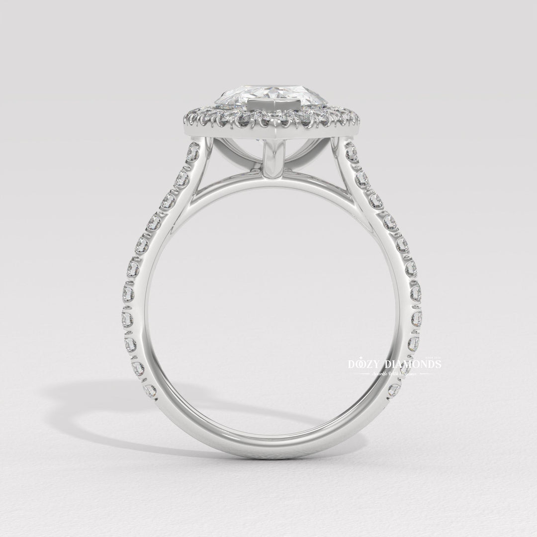 Profile view of pear cut halo engagement ring band
